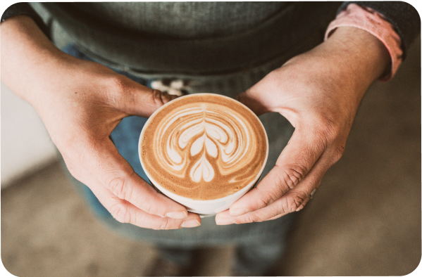 Image of a person holding a coffee mug